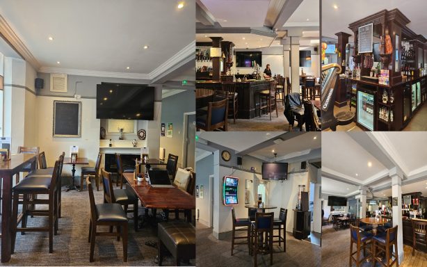 Interior of a pub with wooden furniture, a bar area, and multiple screens displaying sports.